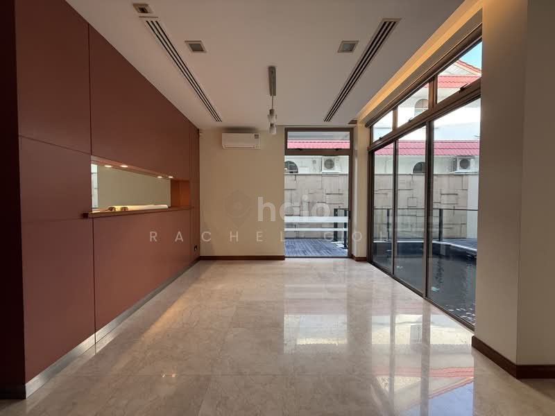Jalan Remis semi-detached — living and dining level with feature cabinetry, looking out to the pool